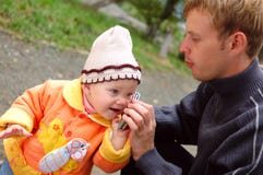 Father And Daughter Talk On Mobile Phone. Royalty Free Stock Photo