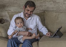 Father with baby son using tablet pc stock images Father with baby son using tablet pc stock images