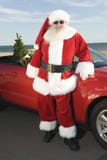 Father Christmas By Convertible With Christmas Tree royalty free stock photo Father Christmas By Convertible With Christmas Tree royalty free stock photo