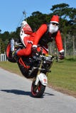 Father Christmas doing front wheel wheelie