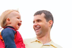 Father Holds Child On Hands And Laugh Stock Image