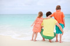 Father with kids at beach stock images Father with kids at beach stock images