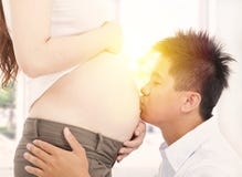 Father Kissing Her Pregnant Tummy Stock Photos Father Kissing Her Pregnant Tummy Stock Photos