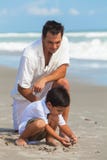 Father Parent Male Boy Child Son Family Beach Fun stock photo Father Parent Male Boy Child Son Family Beach Fun stock photo