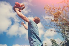 Father playing and catching his daughter in the field outdoors stock image Father playing and catching his daughter in the field outdoors stock image