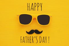 Father& x27;s day concept. Hipster yellow sunglasses and funny moustache. On wooden background Stock Photos Father& x27;s day concept. Hipster yellow sunglasses and funny moustache. On wooden background Stock Photos
