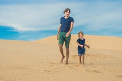 Father and son at the white desert. Traveling with children conc royalty free stock photography Father and son at the white desert. Traveling with children conc royalty free stock photography