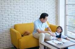 Father teach young girl child to do homework together,Happy and fun,Family love royalty free stock images Father teach young girl child to do homework together,Happy and fun,Family love royalty free stock images