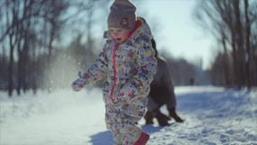 4K Snowball game. Father and his little child play winter snowball game. stock video 4K Snowball game. Father and his little child play winter snowball game. stock video