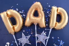 Fathers Day gold Dad balloons.