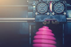 FDM 3D-printer manufacturing wound pink easter egg sculpture - front view on object and print head royalty free stock photo FDM 3D-printer manufacturing wound pink easter egg sculpture - front view on object and print head royalty free stock photo