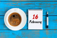 February 16th. Day 16 of month, Top view on calendar and morning coffee cup at workplace background. Winter time royalty free stock image February 16th. Day 16 of month, Top view on calendar and morning coffee cup at workplace background. Winter time royalty free stock image