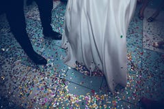 Feet of the bride and groom on a background of confetti royalty free stock images Feet of the bride and groom on a background of confetti royalty free stock images