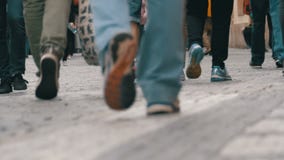 Feet of Crowd People Walking on the Street