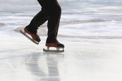 Feet on the skates of a person rolling on the ice rink royalty free stock images Feet on the skates of a person rolling on the ice rink royalty free stock images