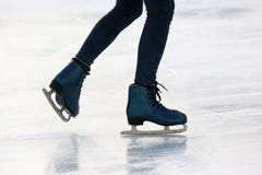 Feet on the skates of a person rolling on the ice rink royalty free stock image Feet on the skates of a person rolling on the ice rink royalty free stock image