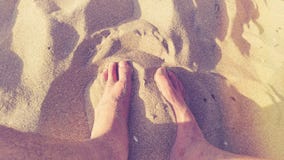 Feet in warm sand stock images Feet in warm sand stock images