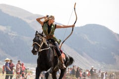 Female archer shooting an arrow on horseback. Royalty Free Stock Photography Female archer shooting an arrow on horseback. Royalty Free Stock Photography