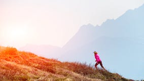 Female athlete ago in the mountains training stock image Female athlete ago in the mountains training stock image