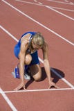Female Athlete Ready To Race On Track royalty free stock photography Female Athlete Ready To Race On Track royalty free stock photography