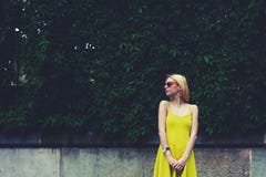 Female cute hipster girl standing against blank copy space for text message or content royalty free stock images Female cute hipster girl standing against blank copy space for text message or content royalty free stock images
