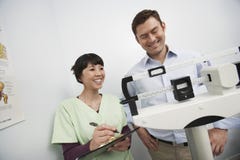 Female Doctor Checking Weight Of Patient royalty free stock photos Female Doctor Checking Weight Of Patient royalty free stock photos