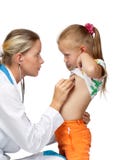 Female doctor examining a child stock photo Female doctor examining a child stock photo