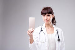 Female doctor holding a raised mobile phone royalty free stock images Female doctor holding a raised mobile phone royalty free stock images