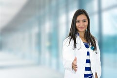 Female doctor with open hand ready for handshake in hospital royalty free stock photo Female doctor with open hand ready for handshake in hospital royalty free stock photo