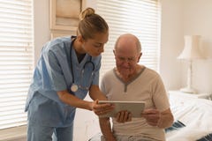 Female doctor and senior man using digital tablet stock photography Female doctor and senior man using digital tablet stock photography