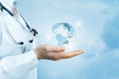 A female doctor with a stethoscope on her neck is holding a crystal, sparkling global map on her hand . stock images A female doctor with a stethoscope on her neck is holding a crystal, sparkling global map on her hand . stock images
