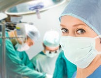 Female doctor with surgical team