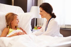 Female Doctor Talking To Child Patient In Hospital Bed Stock Image Female Doctor Talking To Child Patient In Hospital Bed Stock Image