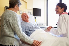Female Doctor Talking To Senior Couple In Hospital Room Royalty Free Stock Photo Female Doctor Talking To Senior Couple In Hospital Room Royalty Free Stock Photo