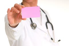 Female Doctor With Stethoscope Holding A Pink Note Stock Image
