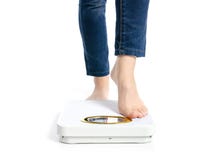 Female feet weighing scale royalty free stock image Female feet weighing scale royalty free stock image