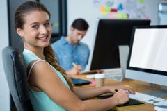 Female graphic designer using graphics tablet at desk royalty free stock images Female graphic designer using graphics tablet at desk royalty free stock images