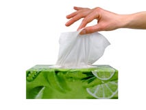 Female hand taking a tissue from a box