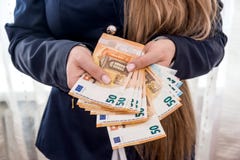 Female hands holding 50 euro banknotes, royalty free stock photos Female hands holding 50 euro banknotes, royalty free stock photos