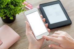 Female hands holding phone with screen on women table royalty free stock image Female hands holding phone with screen on women table royalty free stock image