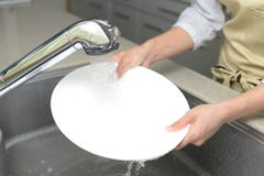 Woman wash the dishes Royalty Free Stock Images Woman wash the dishes Royalty Free Stock Images