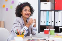 Female interior designer with coffee cup at desk royalty free stock photos Female interior designer with coffee cup at desk royalty free stock photos