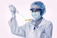 Female Lab Technician With Pipette And Liquid Stock Photos