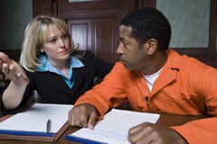 Female Lawyer With Criminal In Courtroom royalty free stock images Female Lawyer With Criminal In Courtroom royalty free stock images