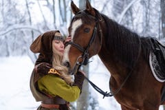 Female magician with a horse in the winter royalty free stock image Female magician with a horse in the winter royalty free stock image