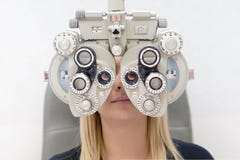 Female Optometrist Doing Sight Testing For female Patient In Clinic royalty free stock images Female Optometrist Doing Sight Testing For female Patient In Clinic royalty free stock images