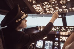 Female pilot captain prepares for take-off plane
