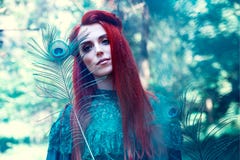 Female Portrait With Peacock Feather On Foreground. Beauty Makeup. Stock Photo
