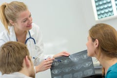 Female professional taking xray patient royalty free stock photography Female professional taking xray patient royalty free stock photography
