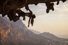 Female rock climber at sunset stock image Female rock climber at sunset stock image